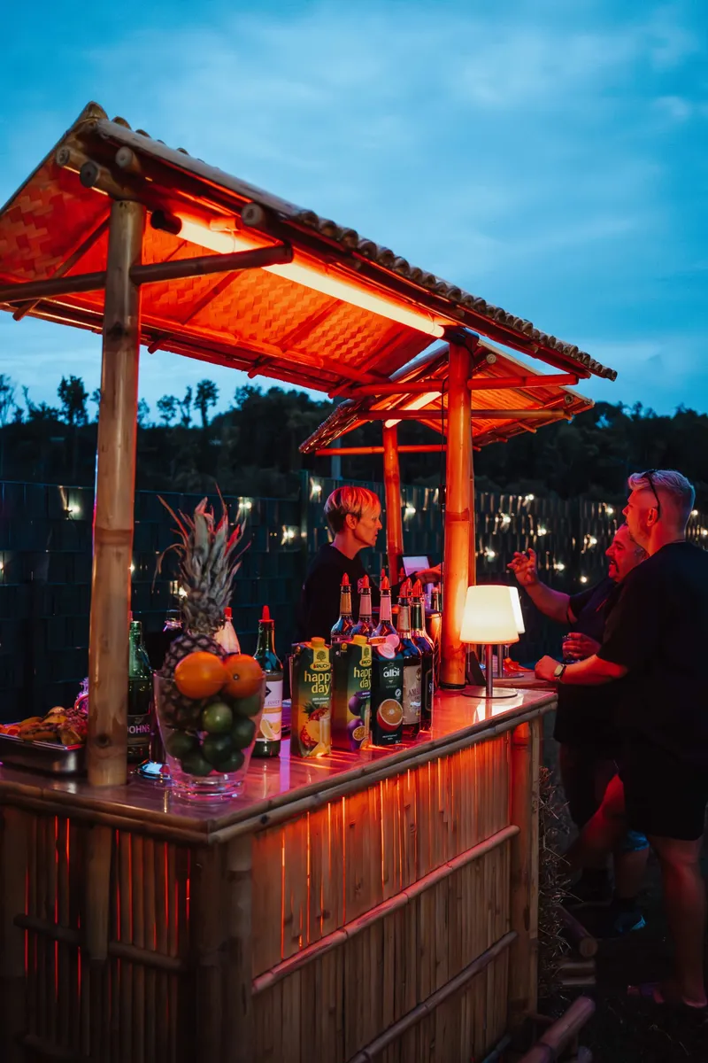 Bamboo bar by Pfeil's Catering at an evening event