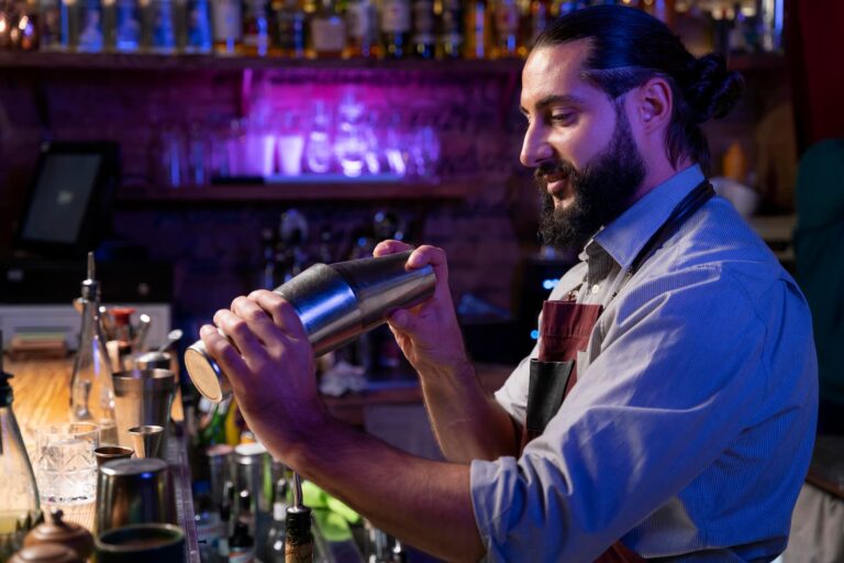 Bartender with cocktail shaker during a show performance